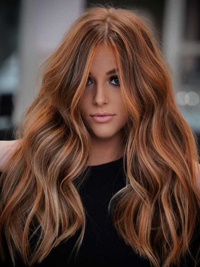 Balayage rosso su capelli lunghi e folti